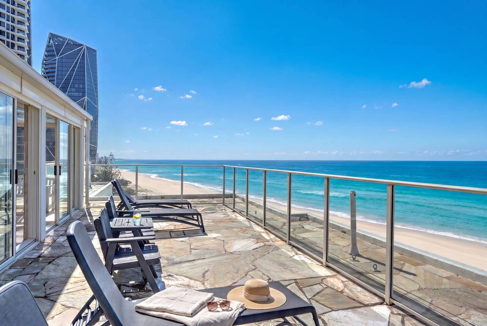 Rooftop lounge chairs overlooking the beach at Viscount on the Beach